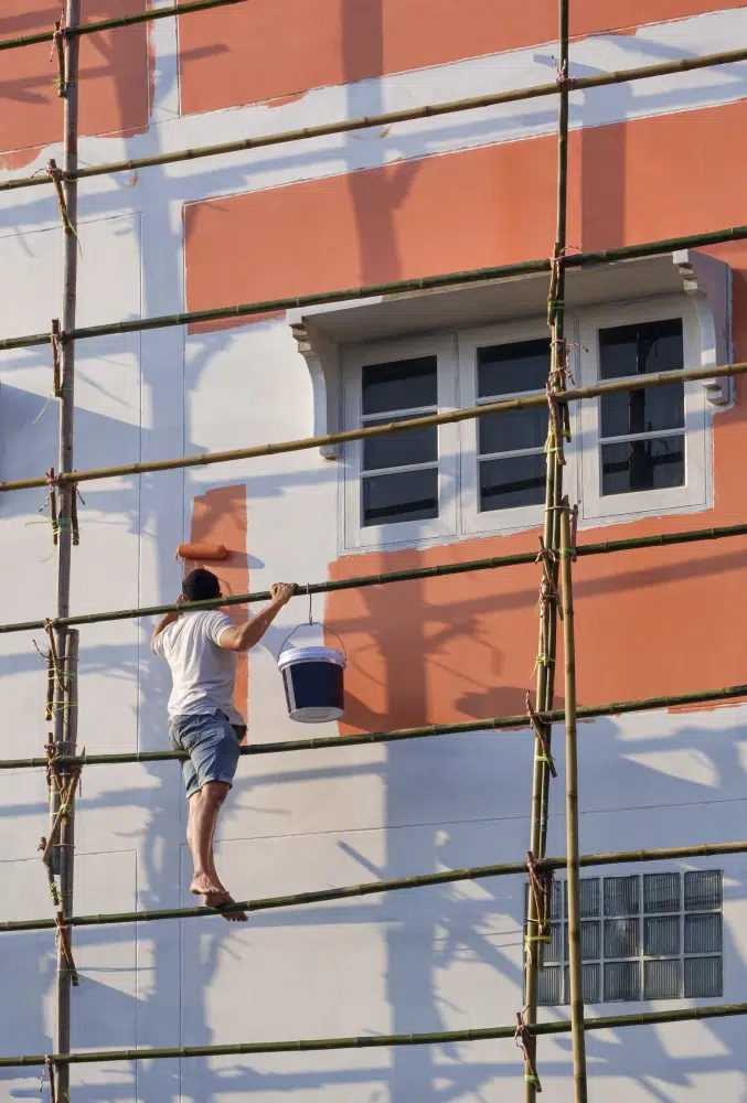 asian-builder-worker-on-wooden-scaffolding-is-pain-2025-03-10-17-22-44-utc