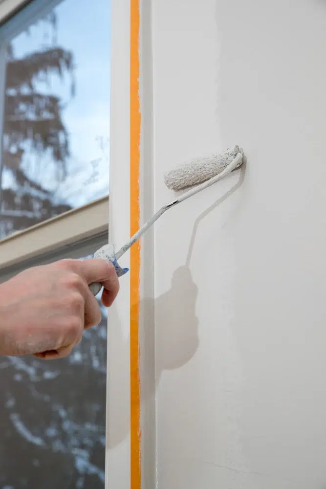 painting-apartment-renovating-with-white-color-paint-roller-room